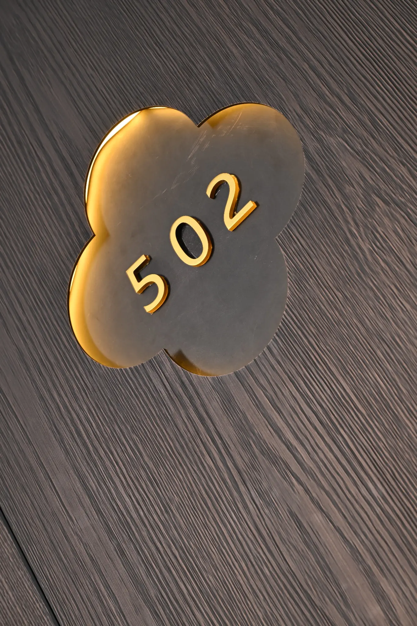 Backlit 502 identifier integrated into the exhibited entrance surface