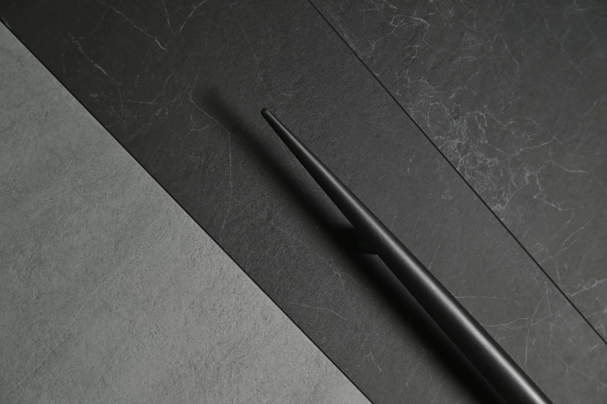 Paired pull handles coordinated across contrasting EPIN TOMCIM door surfaces