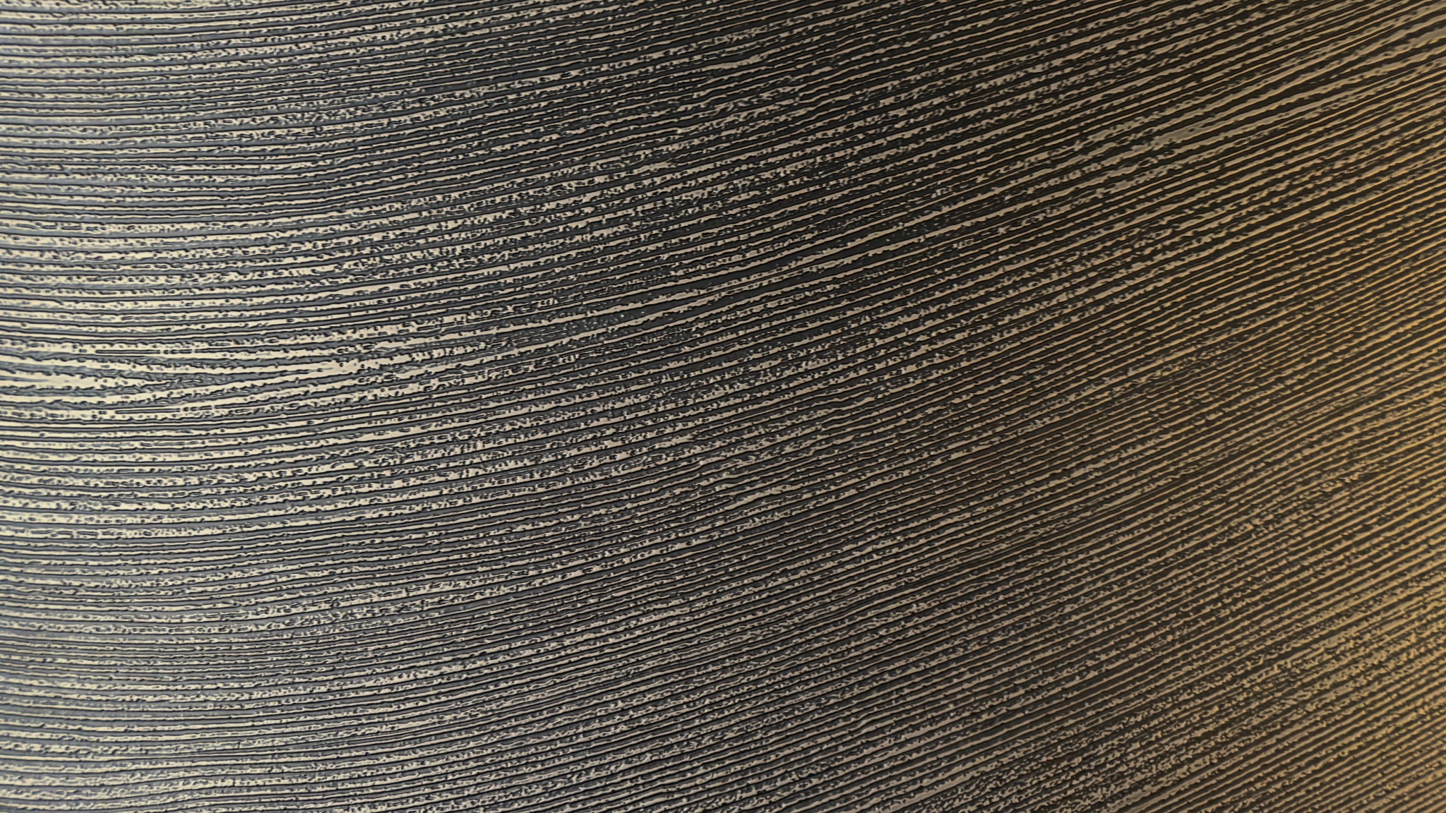 Closely spaced bronze-tone linear ridges
